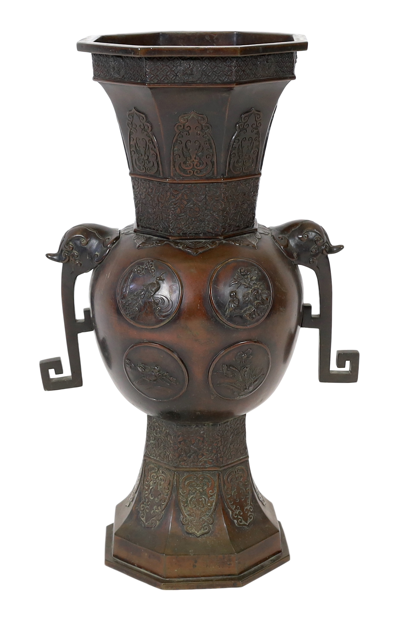 A tall Japanese archaistic bronze octagonal vase, Meiji period, base panel lacking